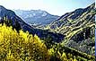 The view down a mountain valley in summer.